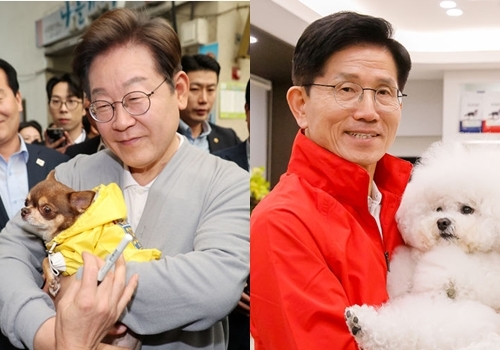이재명 더불어민주당 대선후보(사진 왼쪽)가 지난 11일 전남 강진군 강진오감통시장서, 김문수 국민의힘 대선후보가 지난 13일 대구의 한 동물병원서 애완견을 안은 채 기념촬영하고 있다. ⓒ뉴시스